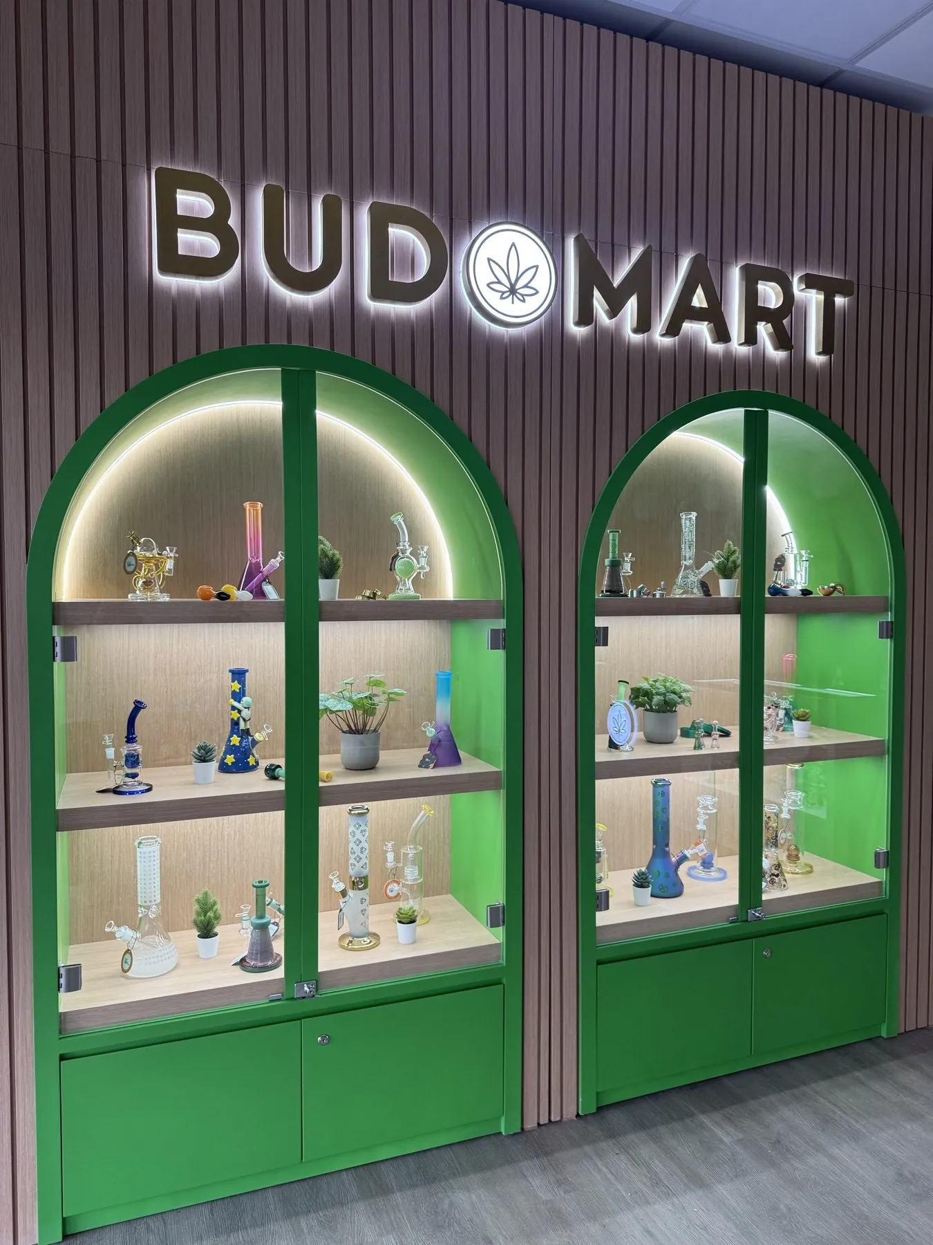 Bud Mart arch display cabinets, custom retail interior design by KINN Studios Calgary