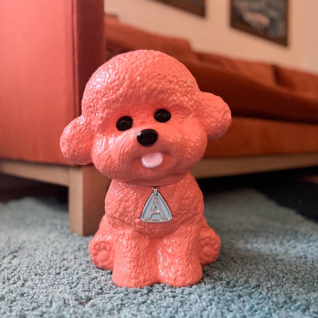 Close-up of Aritzia ceramic Bichon Frise dog sculpture collectible