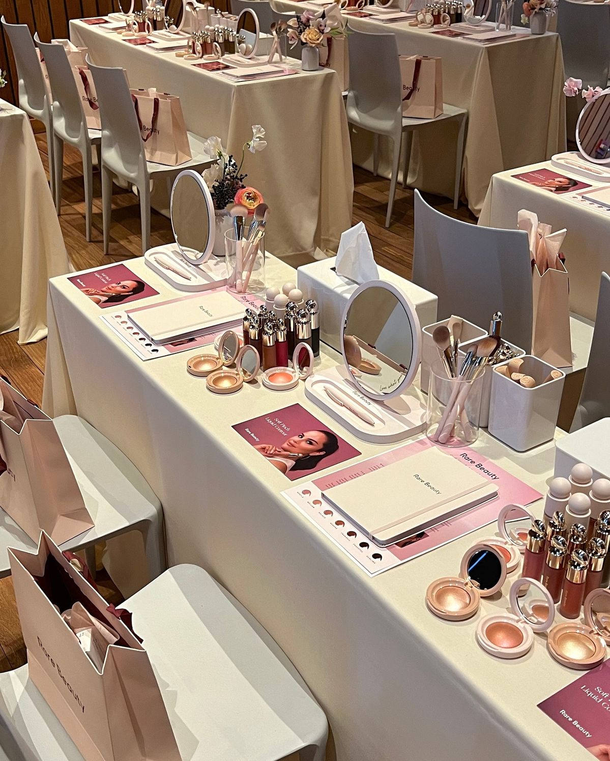Rare Beauty Soft Pinch Liquid Contour masterclass with curated place settings, mirrors, brushes and product displays
