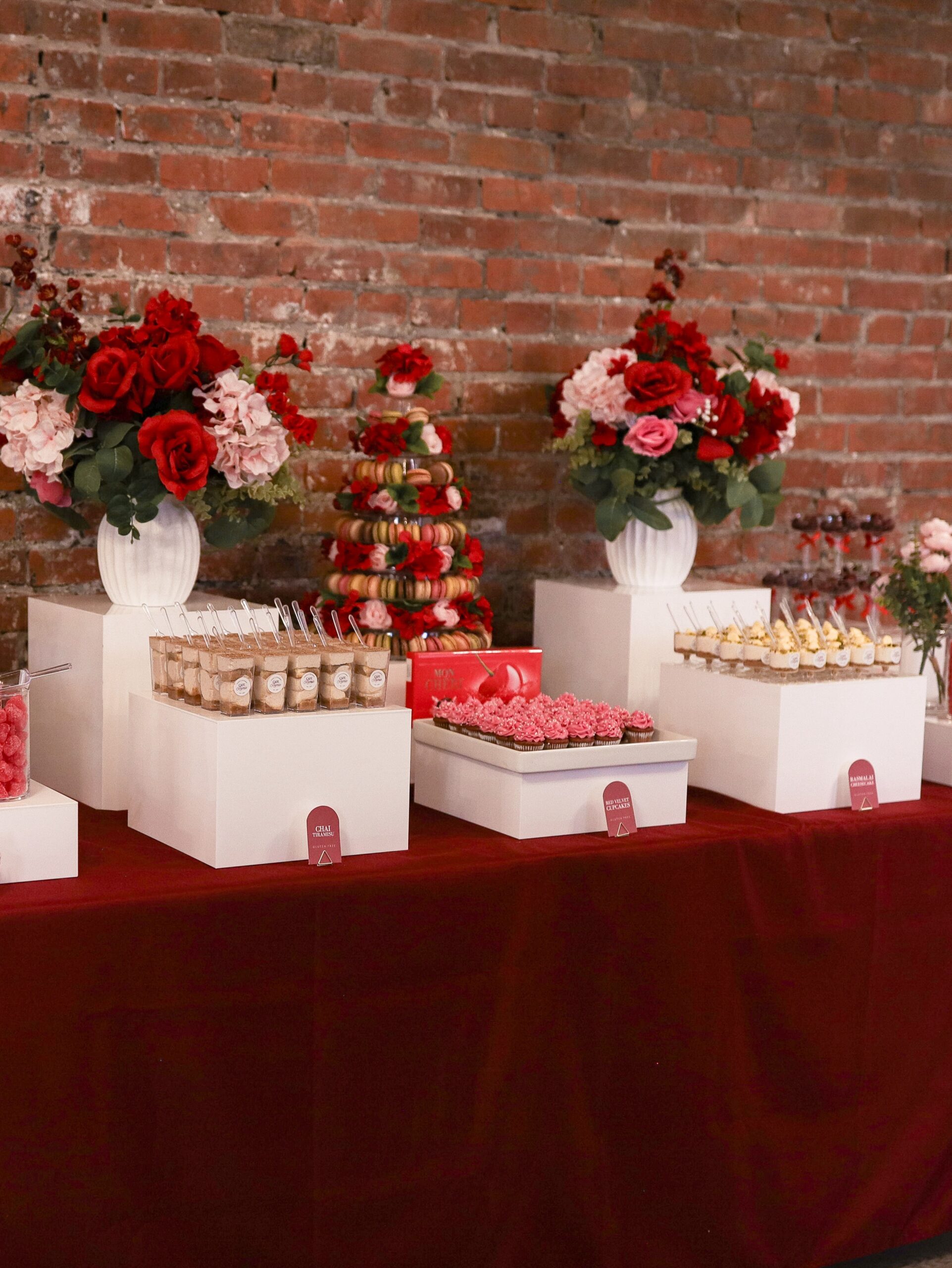 Cherry-themed dessert table display at Ma Chérie bridal shower, gluten-friendly confections styled in French boutique aesthetic, Calgary event by KINN Studios and Deep's Delights Catering