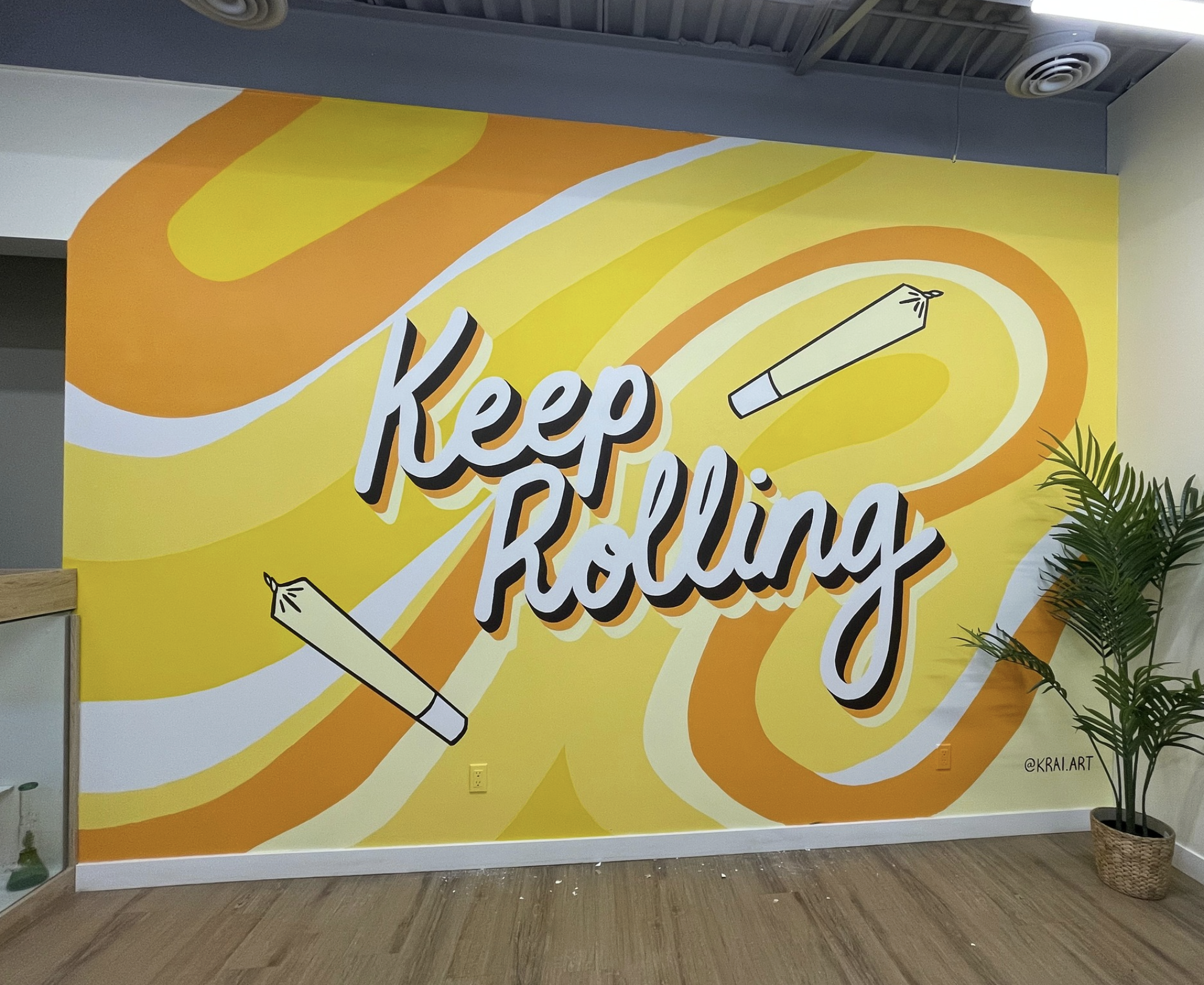Keep Rolling mural by KINN Studios, commercial interior art Calgary