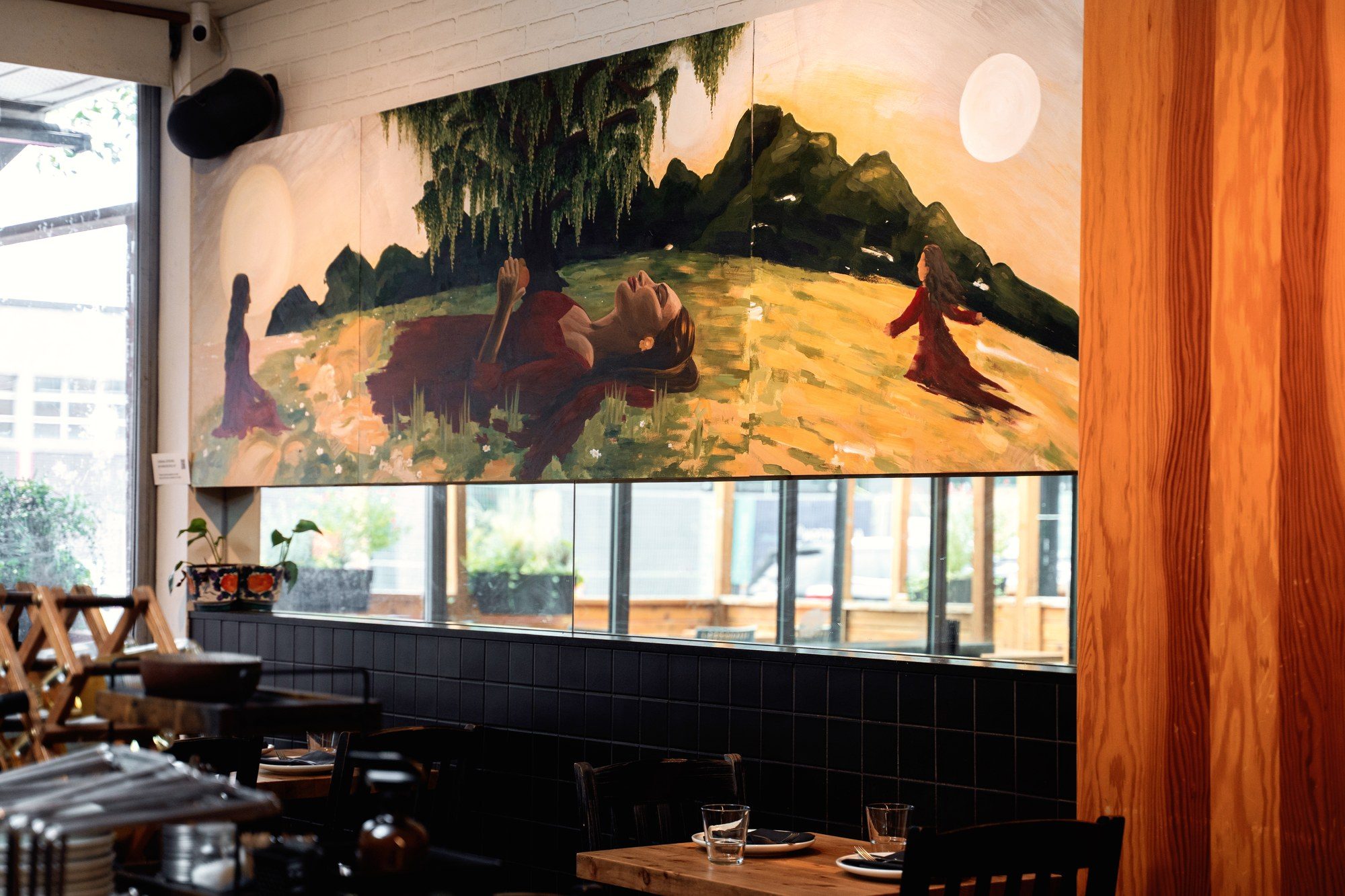 Painted artboard across the east wall of the UNA Pizza + Wine dining room on 17th Avenue SW, Calgary, by KINN Studios