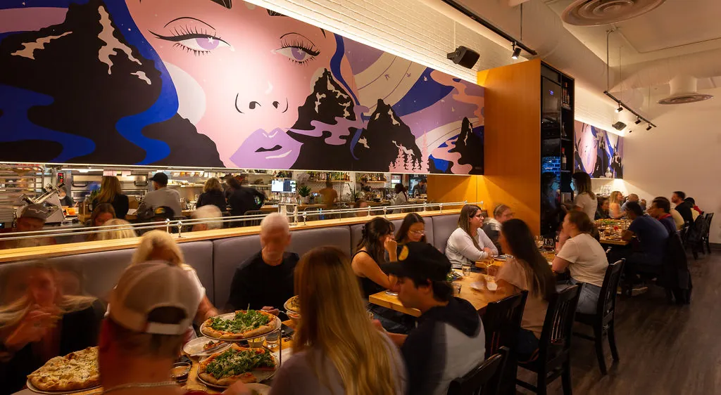 Uprooted mural at UNA Pizza and Wine in Bridgeland, designed experience Calgary by KINN Studios