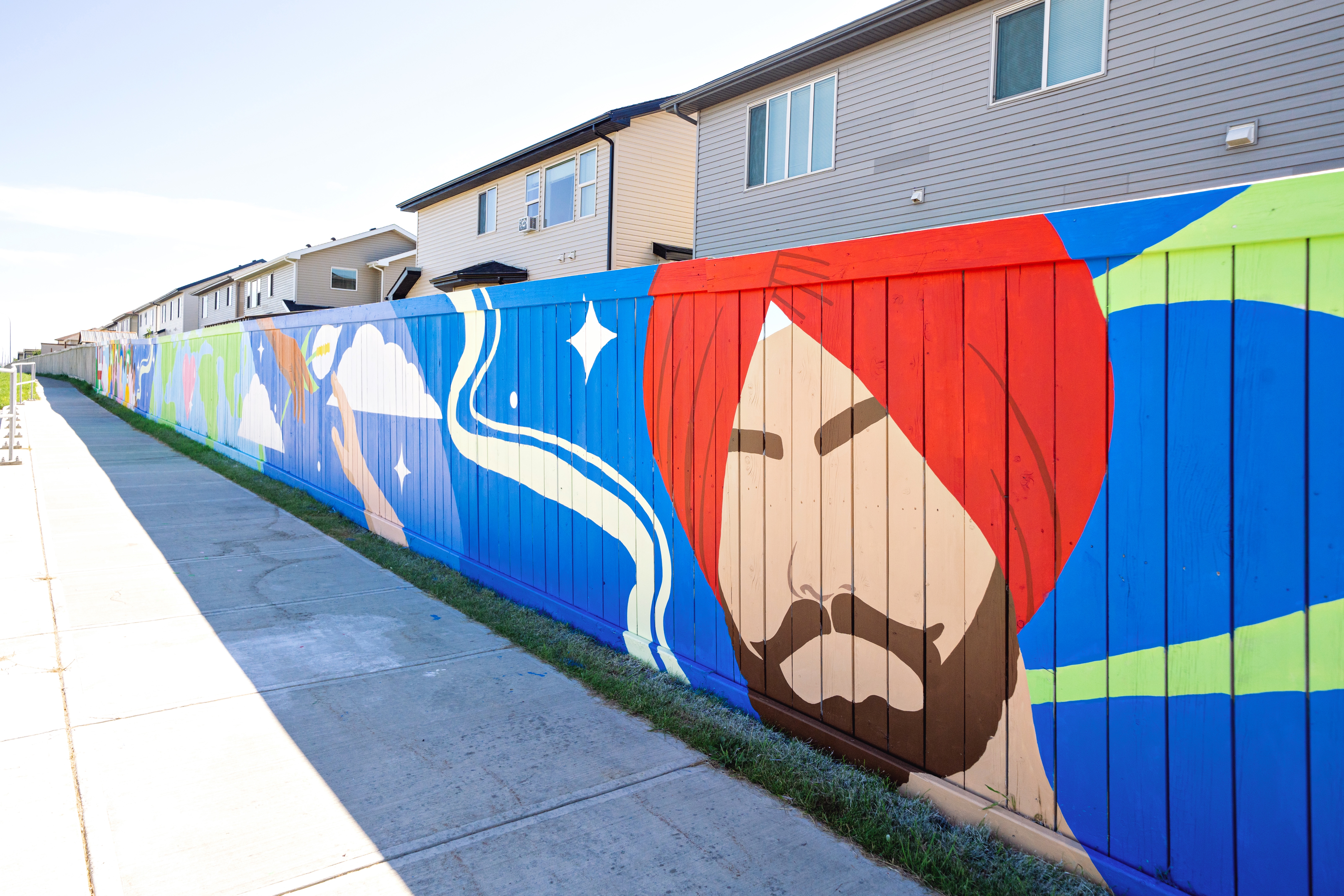 Detail of a turbaned figure painted on the Vibrance in Diversity mural, celebrating South Asian heritage in Calgary's multicultural NE community