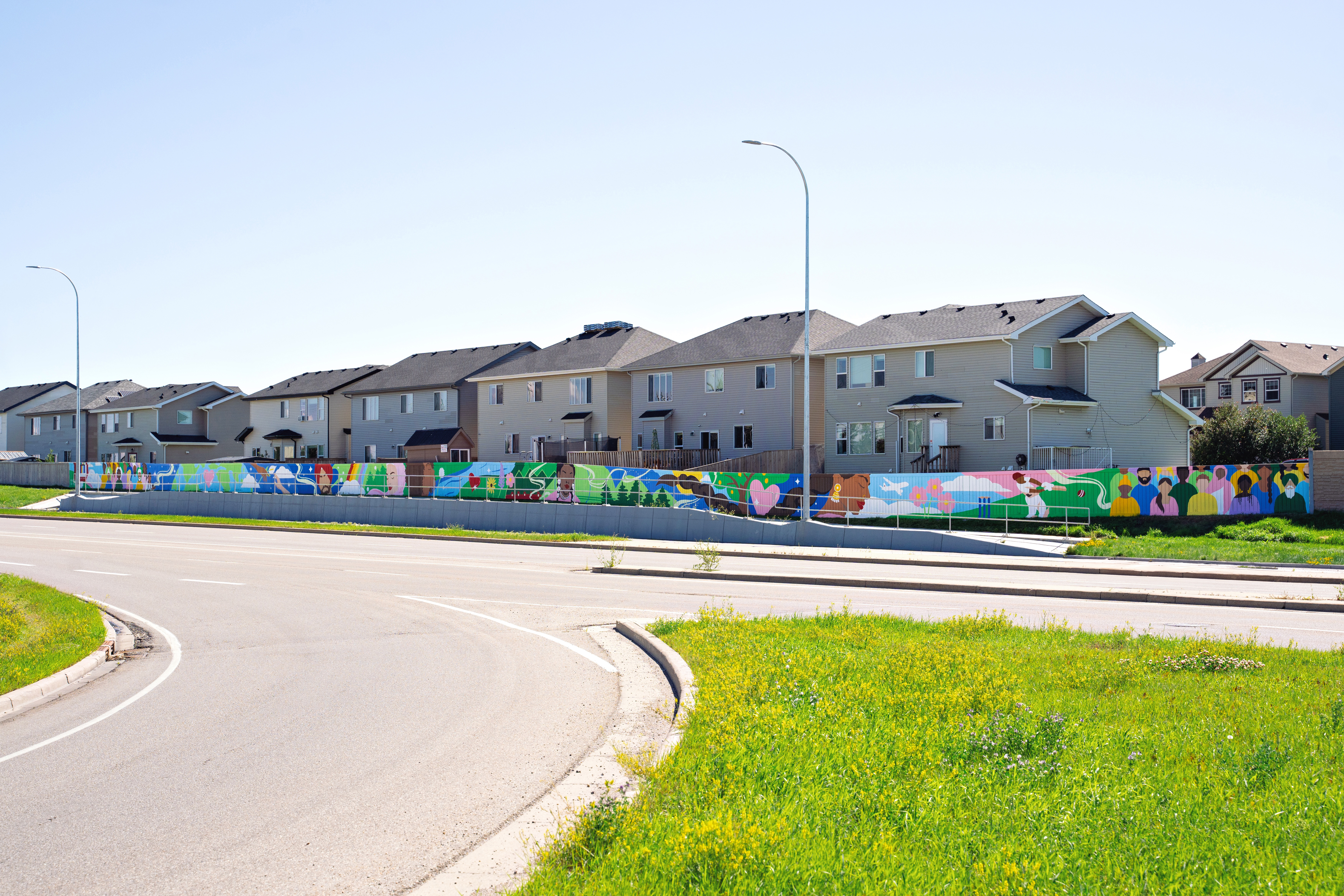 Vibrance in Diversity, 100-metre community mural in NE Calgary, panoramic view of the full exterior wall