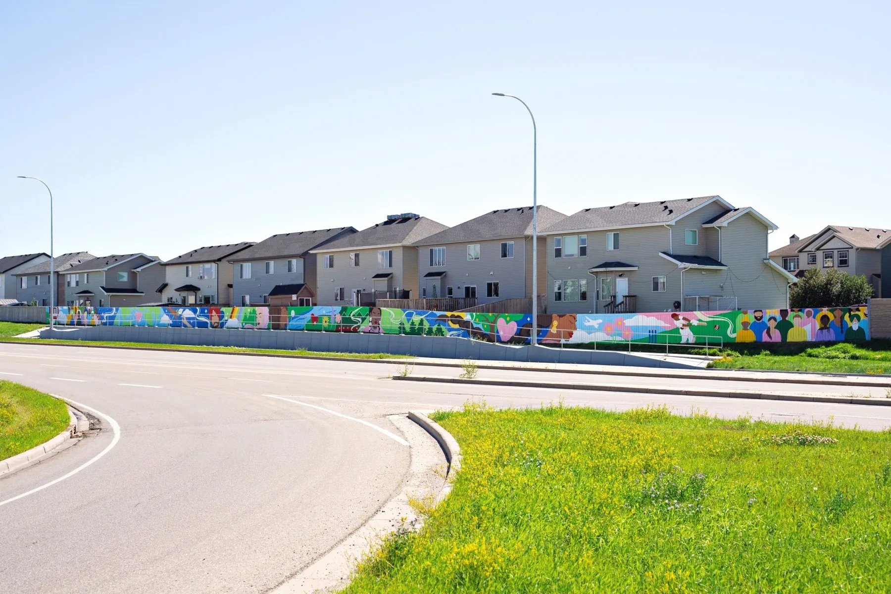 Vibrance in Diversity 100-metre community mural in NE Calgary, experience design by KINN Studios